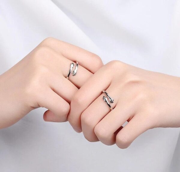couple hug pair ring