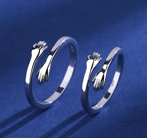 couple hug pair ring