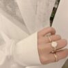 cream three set ring with elegant design