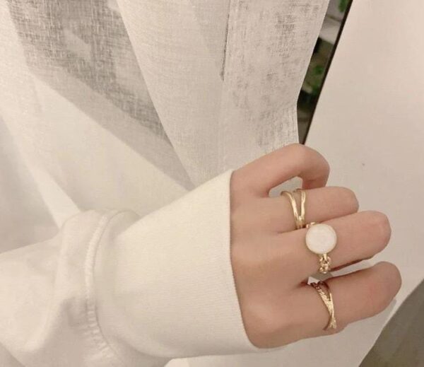 cream three set ring with elegant design