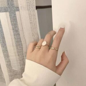 cream three set ring with elegant design