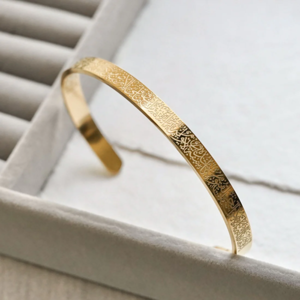 golden ayat ul kursi cuff bracelet with intricate islamic engraving