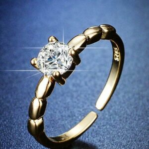 chic one stone golden plated metal ring with sleek design