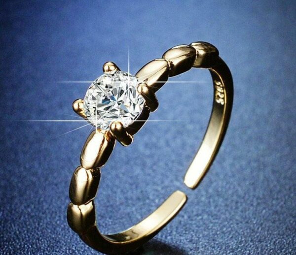 chic one stone golden plated metal ring with sleek design