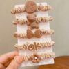 set of 5 brown silicone rubber ponies for secure hold