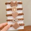 set of 5 brown silicone rubber ponies for secure hold