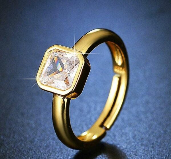 sleek golden plated metal ring with polished finish