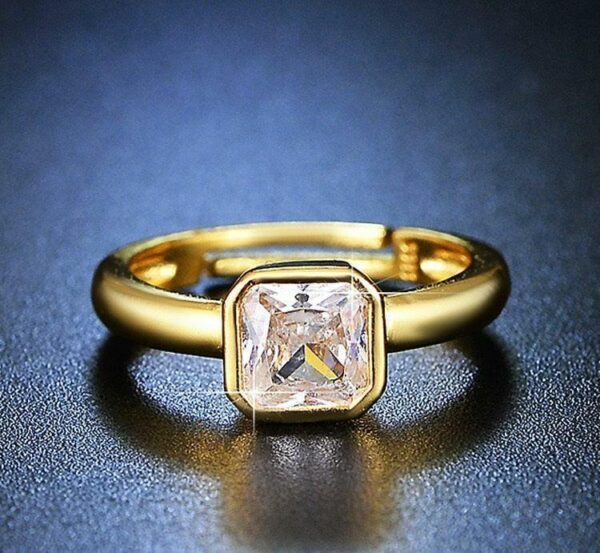 sleek golden plated metal ring with polished finish
