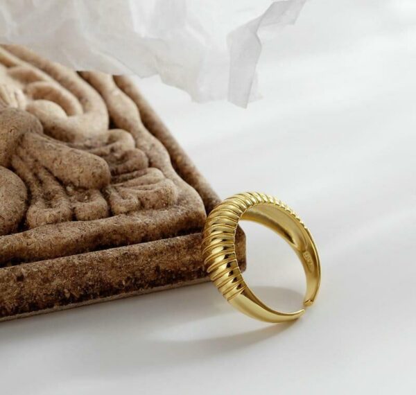 snail style golden metal ring with unique spiral design